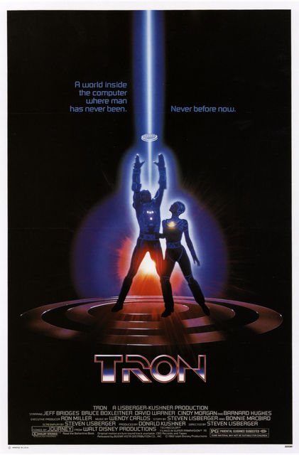 TRON theatrical poster from 1982 with Tron holding up a disc with Yori nearby